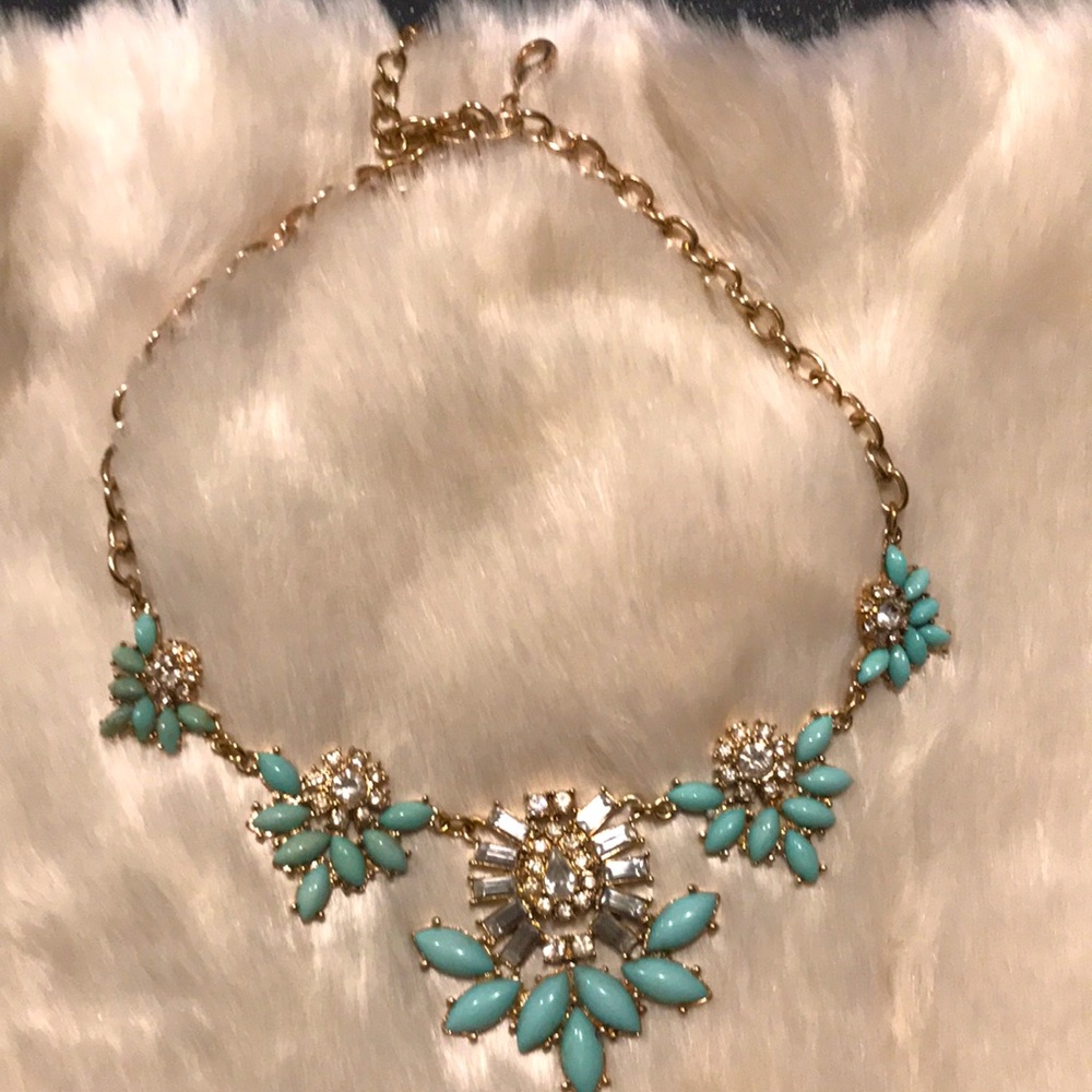 Turquoise colored necklace with rhinestones.